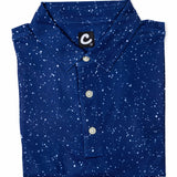 Folded blue polo shirt with white speckles on a white background