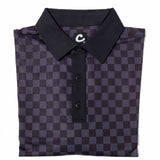 Folded black and gray checkered polo shirt with a brand logo on a white background
